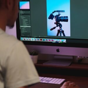 silver imac on brown wooden desk